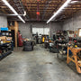 4ft LED Tube 14W 1800 lumens 3500K ballast bypass lighting brightens a large workshop space efficiently